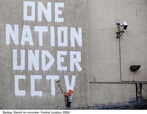 Banksy stencil on a concrete wall that says "One Nation Under CCTV". London. 2008.