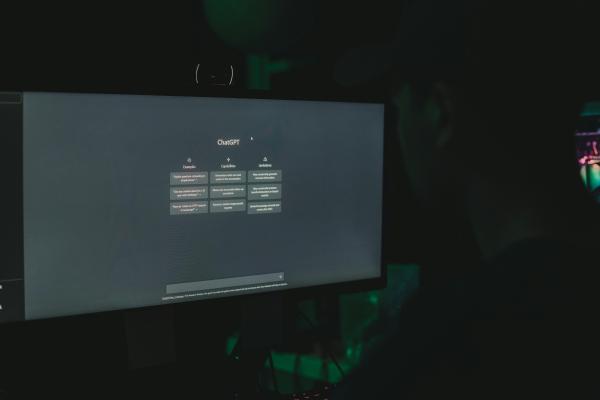 Computer screen with a small table showing ChatGPT examples, capabilities and limitations