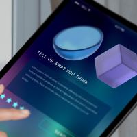 Tablet screen showing 'Tell us what you think'